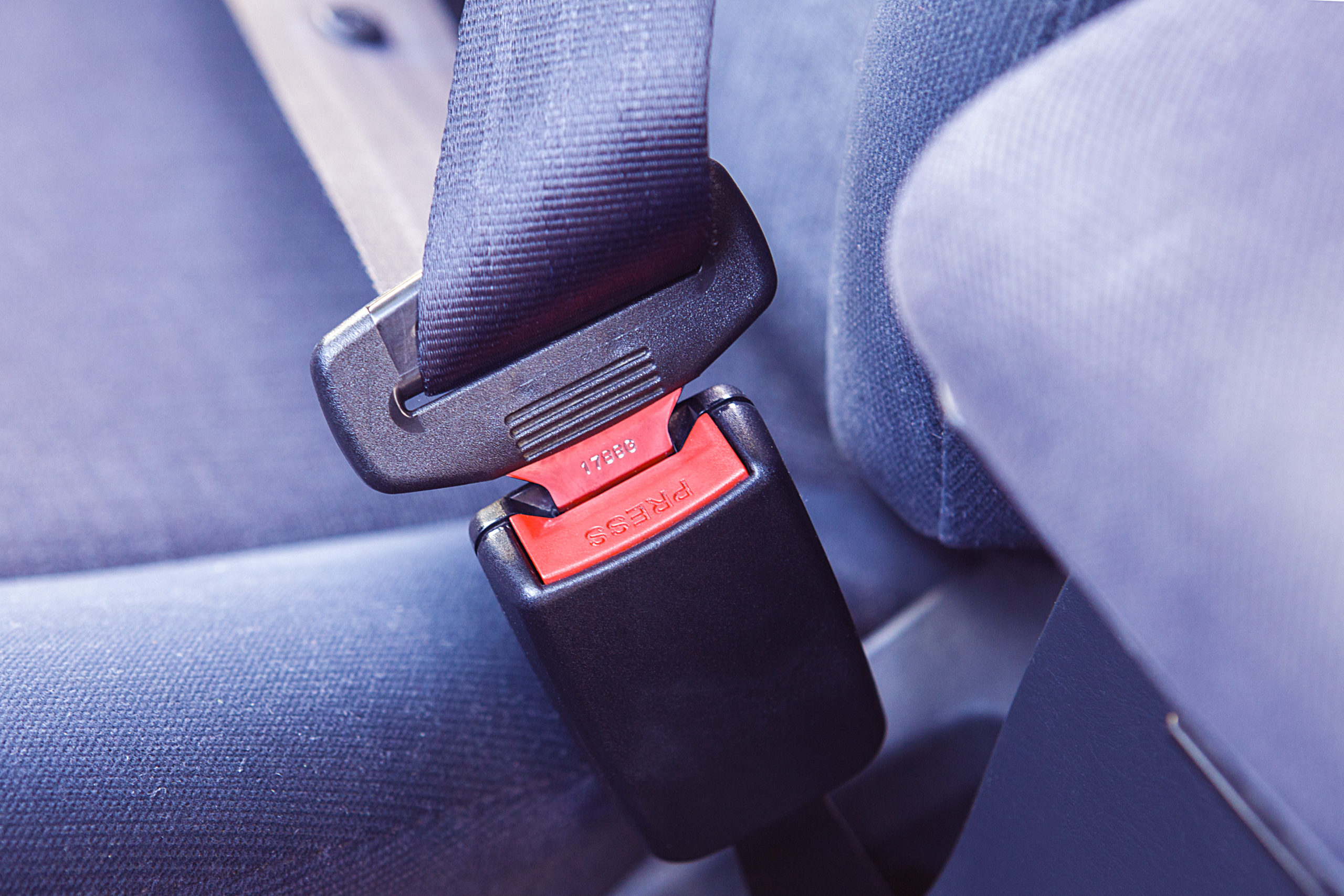 Why Your Seatbelt Has a Fabric Loop—and the Driver's Seatbelt Doesn't