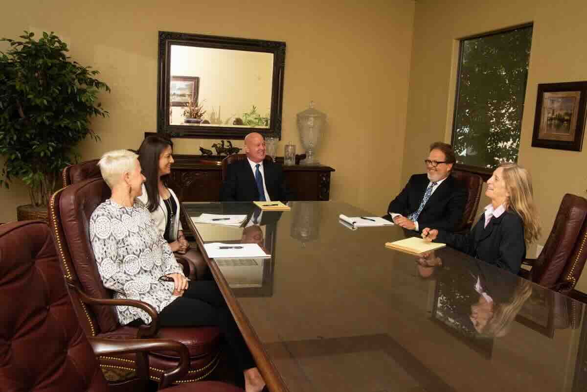 Baumgartner Law Firm legal team reviewing a The Woodlands personal injury claim